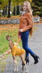 woman-with-her-pet-baby-giraffe-114493